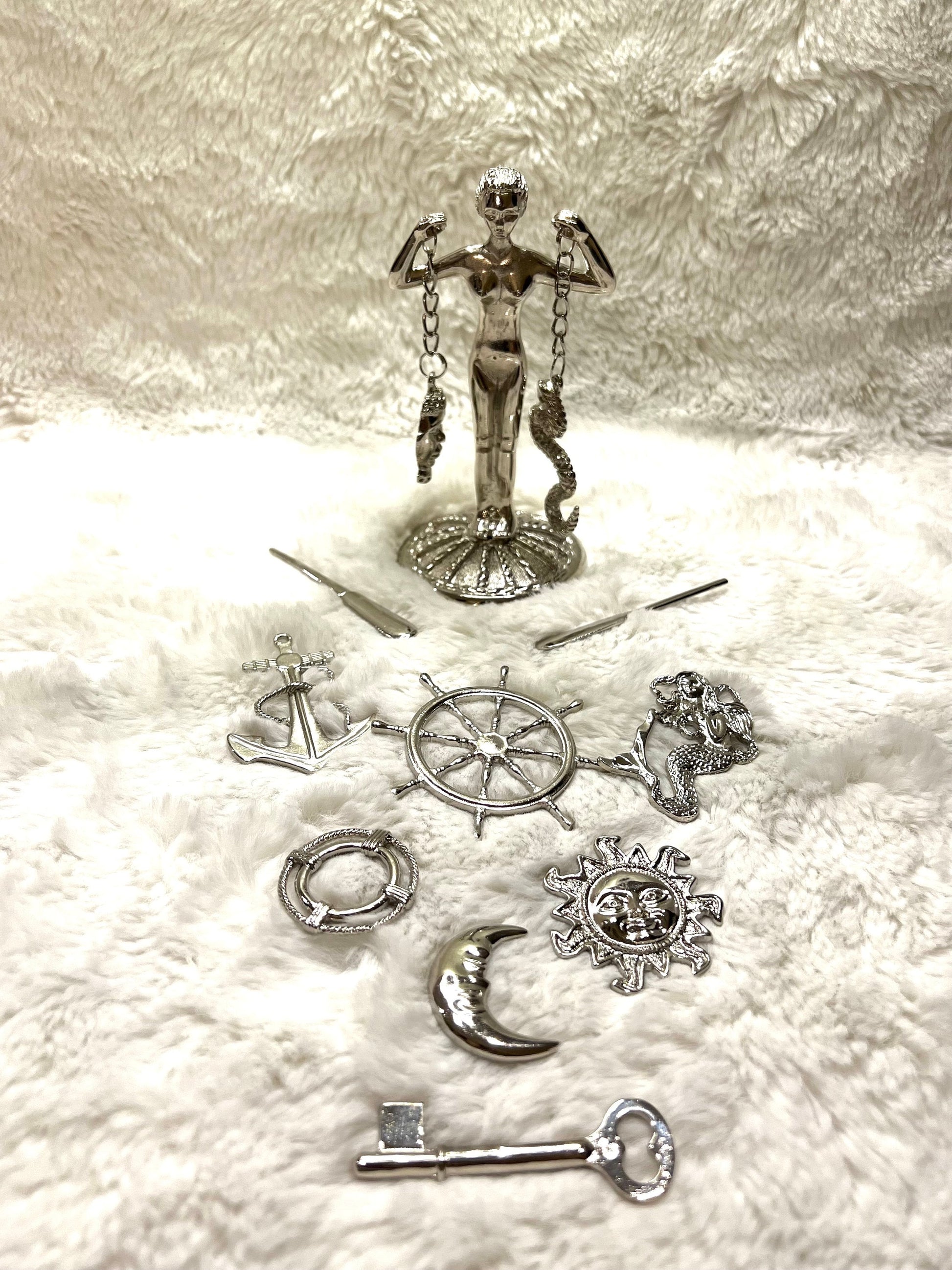 Olokun Tools and Ceramic Tinajas